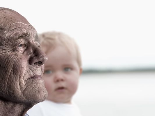 Elderly person and young child